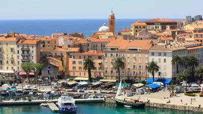 a city with boats in the water near a harbor at Appartement T3 centre ville in Ajaccio