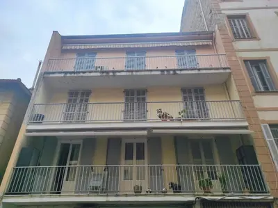 an apartment building with a balcony in a city at Appartement T3 centre ville in Ajaccio