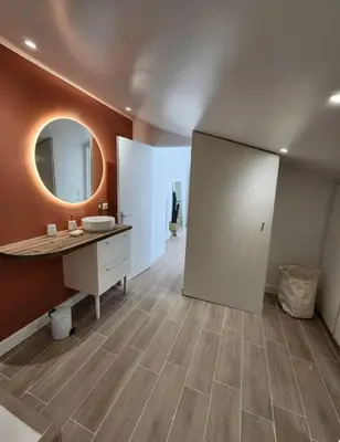 a bathroom with a sink and a mirror at T2 Sanguinaires - 150m de la mer in Ajaccio