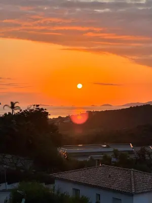 a sunset from the roof of a house at T3 Le Bohème au Villas Acum - Domaine de Standing avec Vue Mer & Excellente situation géographique in Grosseto-Prugna