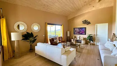 a living room with two white couches and mirrors at Villa Dalenassara, 14 pers, piscine chauffée, 2 min plage en voiture in Olmucciu