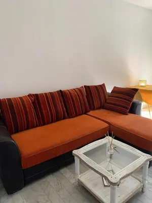 a living room with a couch and a coffee table at Coin de paradis aux Sanguinaires in Ajaccio
