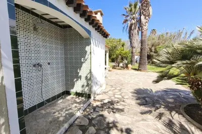 a shower in the side of a house at Ecological house with solar electricity in Ajaccio