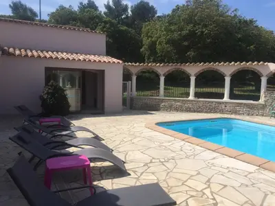 a patio with chairs and a swimming pool at Domaine De Foresta in Bonifacio