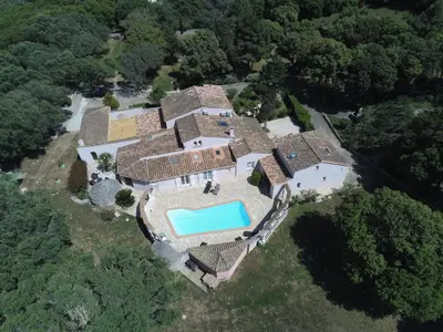 an aerial view of a house with a swimming pool at Domaine De Foresta in Bonifacio