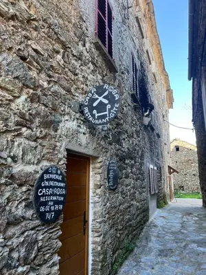 a building with a clock on the side of it at Casa Rosa in Gavignano