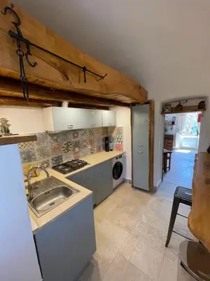 a kitchen with a sink and a stove at Casa Rosa in Gavignano