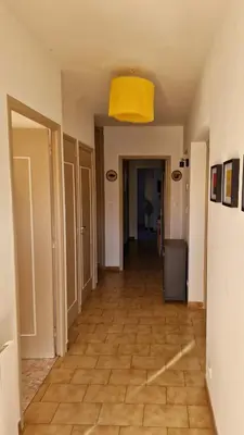 an empty hallway with a yellow ceiling at Villa à quelques pas de la plage in Santa-Lucia-di-Moriani