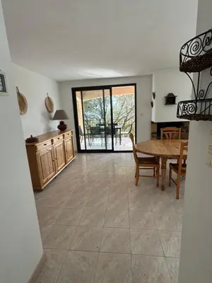 a large living room with a table and chairs at Altagna in Olmeto