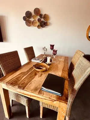 a wooden table with a laptop on top of it at Le Deck Porticcio in Grosseto-Prugna