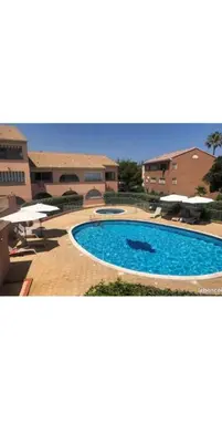 a large swimming pool in front of a building at linguizzetta , les marines de bravone in Linguizzetta
