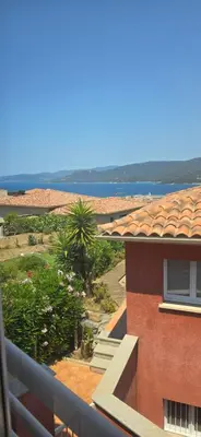 a view of the ocean from a balcony of a building at jolie appartement pour 4 personnes à propriano in Propriano
