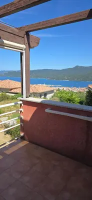 a patio with a view of the water at jolie appartement pour 4 personnes à propriano in Propriano