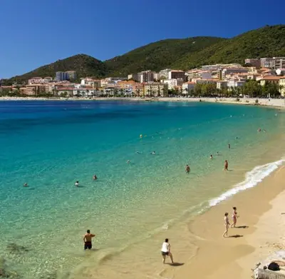 a group of people in the water at a beach at Cœur Ajaccio calme plage nature in Ajaccio