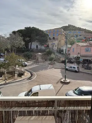 a view of a street with cars parked in a parking lot at Appartement au cœur de Cargèse in Cargèse