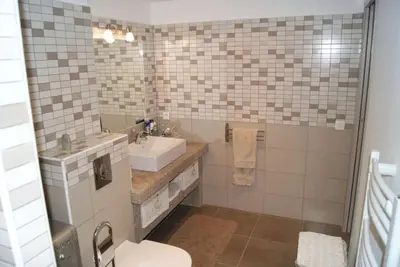 a bathroom with a sink and a toilet at SOLENZARA sea view in Sari Solenzara