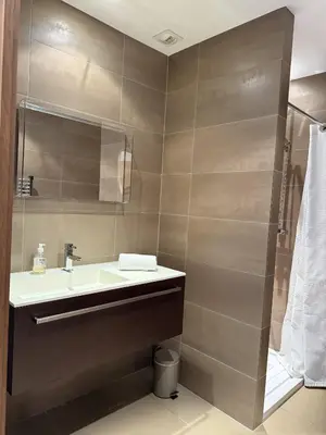 a bathroom with a sink and a shower at T3 Cote Plage n 19 by Pinarello Villa Services in Pinarellu
