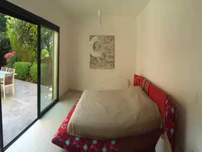 a bedroom with a bed and a large window at Marina di Fiori by Pinarello Villa Services in Furoli
