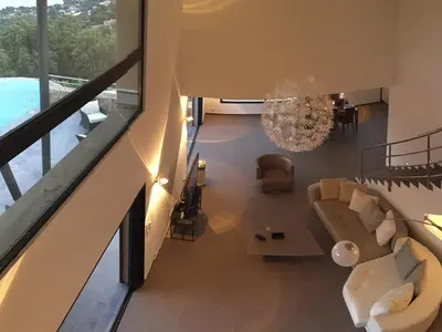 a living room with a couch and a chandelier at Marina di Fiori by Pinarello Villa Services in Furoli