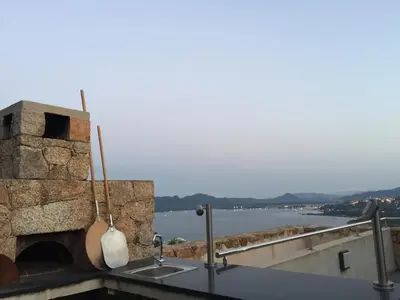 a kitchen with a stone oven and a sink at Marina di Fiori by Pinarello Villa Services in Furoli