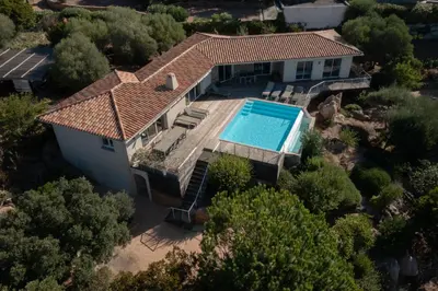 an overhead view of a house with a swimming pool at Padulaccia by Pinarello Villa Services in Pinarellu