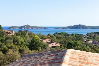 a view of the water from a building at Padulaccia by Pinarello Villa Services in Pinarellu