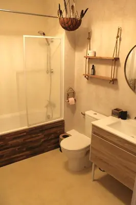 a bathroom with a toilet and a shower and a sink at Villa ALOHA pool-beach 500m in Santa-Maria-Poggio