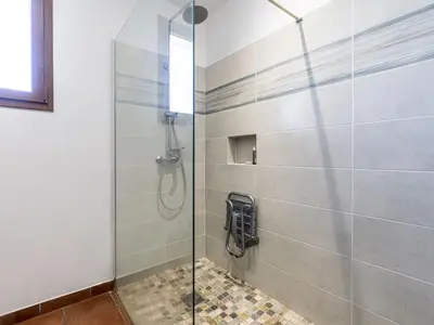 a shower with a glass door in a bathroom at Holiday Home Casa Féminiccia by Interhome in Ghisonaccia