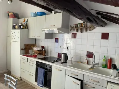 a kitchen with a sink and a stove at Serenita - WiFi, Vue Mer, Central in Bonifacio