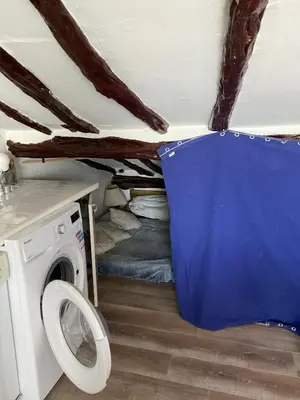 a small room with a washing machine in it at Serenita - WiFi, Vue Mer, Central in Bonifacio