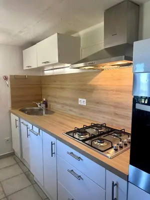 a kitchen with a stove top and a sink at Casa Orsu vue panoramique in Poggio-dʼOletta