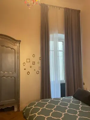 a bedroom with a bed and a window at 120 m2, hyper centre cathédrale proximité plage in Ajaccio