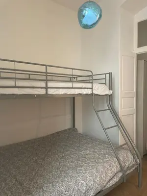 a bunk bed in a room with a blue light at 120 m2, hyper centre cathédrale proximité plage in Ajaccio