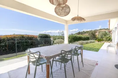 a dining room with a table and chairs at Villa MARE E MACCHIA in Lecci