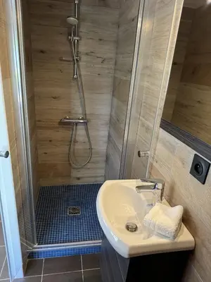 a bathroom with a shower and a sink and a shower at Casadelys in Cala Rossa