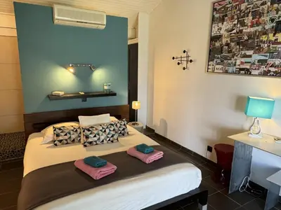 a bedroom with a bed with two towels on it at Casadelys in Cala Rossa