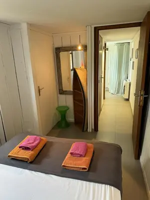 a bedroom with a bed with two towels on it at Casadelys in Cala Rossa