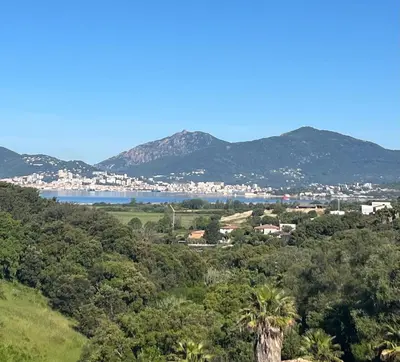 a view of a city and a body of water at Appartement T2 Porticcio in Porticcio