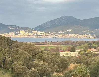 a view of a city and a body of water at Appartement T2 Porticcio in Porticcio