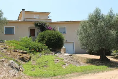 a house with trees and bushes in front of it at Valle Di Casa in Sotta
