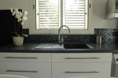 a kitchen with a sink and a window at Valle Di Casa in Sotta