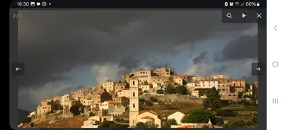 a group of houses on top of a mountain at Superbe Maison de village authentique vue mer in SantʼAntonino