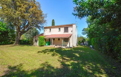a house in a yard with a large grass field at Villa Piscine Privée in Moriani Plage