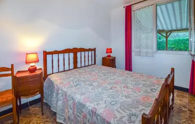 a bedroom with a bed and a window at Villa Piscine Privée in Moriani Plage