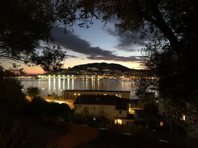 a view of a body of water at night at Confort et modernité Ajaccio in Ajaccio