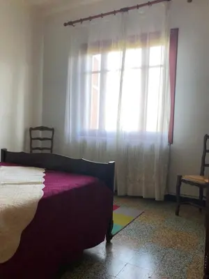 a bedroom with a bed and a window at Lyvia in Serra-di-Ferro