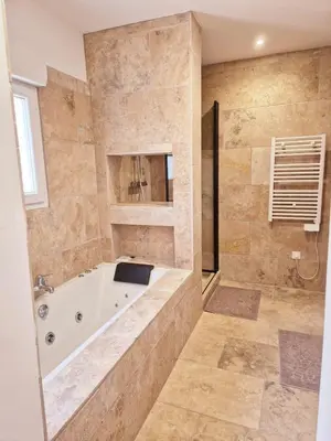 a large bathroom with a tub and a shower at Chambres d hôtes, calme et nature in Pianottoli-Caldarello
