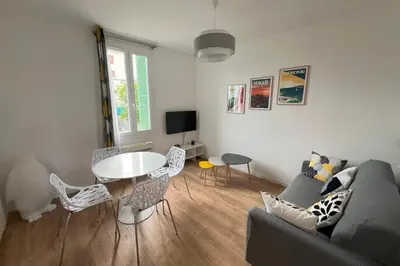 a white bedroom with a bed and a window at Aurélie - Charming 1Br Trottel Beach - by TGB in Ajaccio