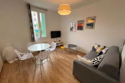 a living room with a kitchen and a table at Aurélie - Charming 1Br Trottel Beach - by TGB in Ajaccio
