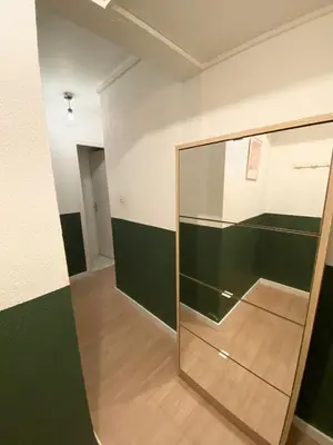 a glass partition in a room with black and white walls at Grand studio neuf, lumineux et au calme ! Tout équipé - Ajaccio in Ajaccio